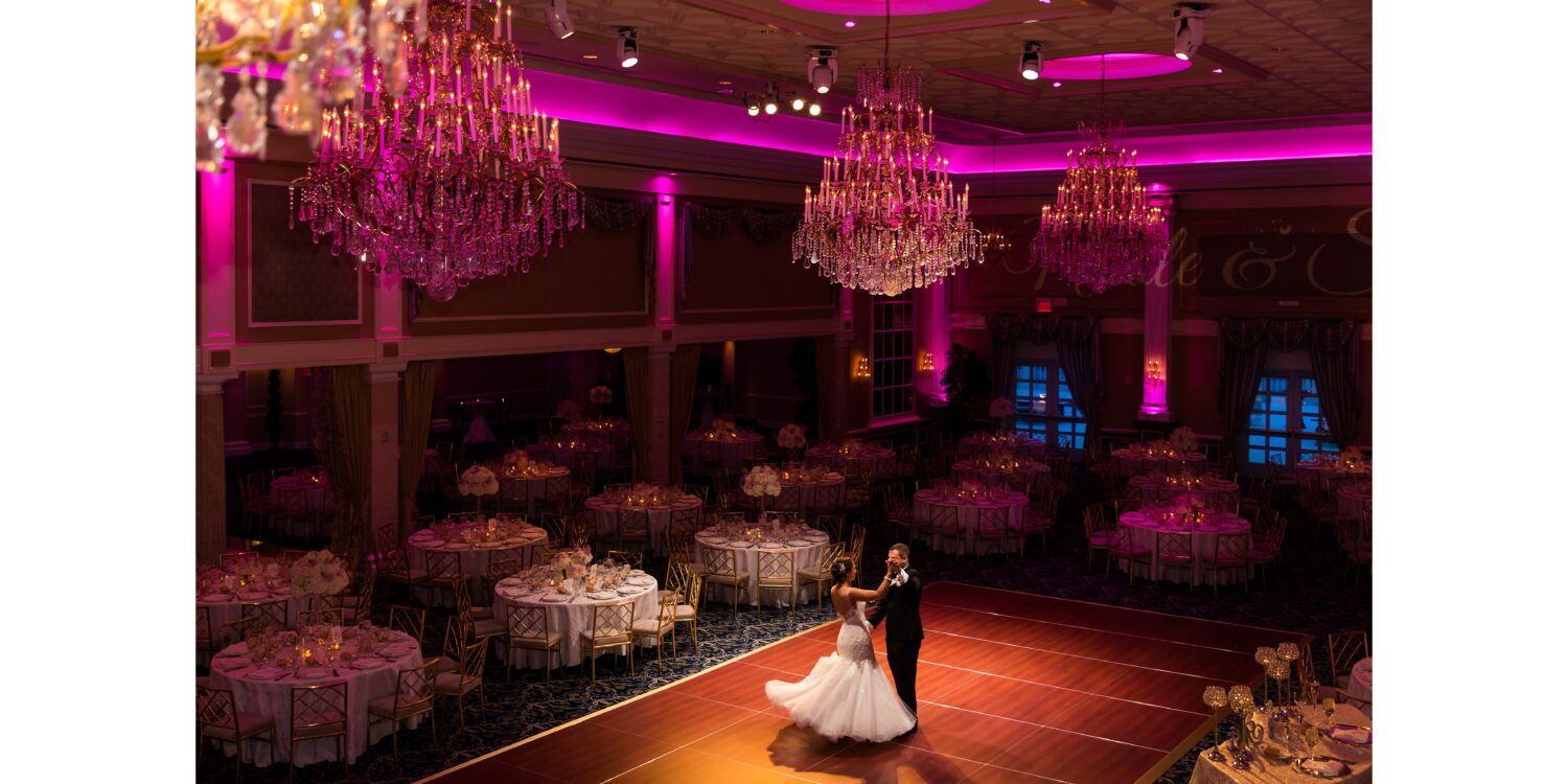 vibrant colorful image of the bride and groom as they share a private dance together in the ballroom at the palace at Somerset Park 
