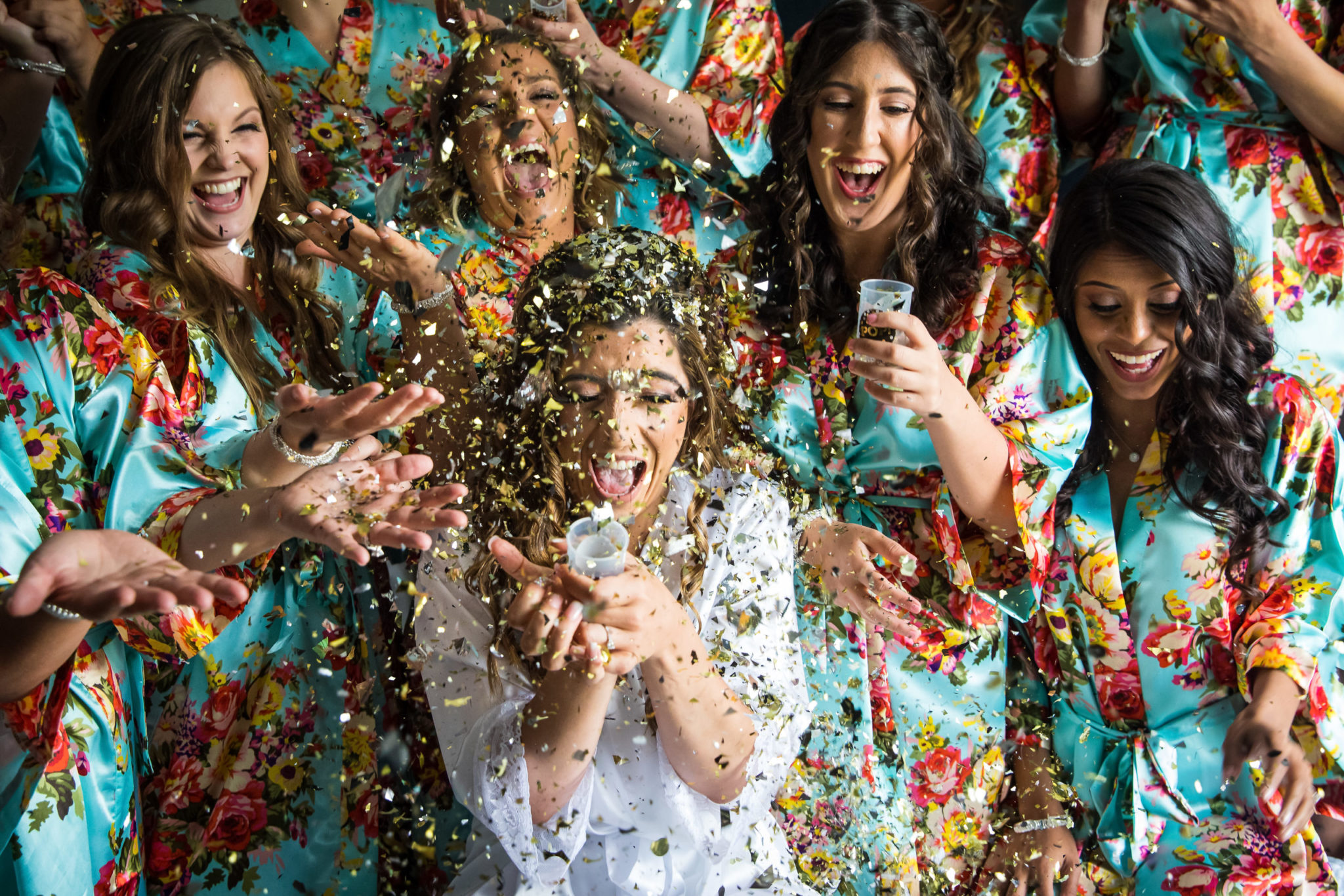 Marigold NJ Wedding Photographer, Lisa Rhinehart, captures this fun, creative, unique image of the bride and her bridesmaids as the confetti falls around them