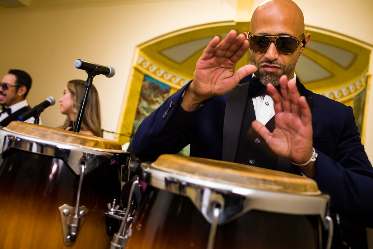 gw memorial ballroom in Arlington musical with sunglasses plays drum in wedding band 