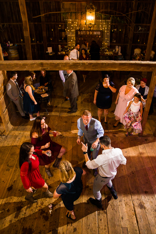 wedding guests dancing in a barn
