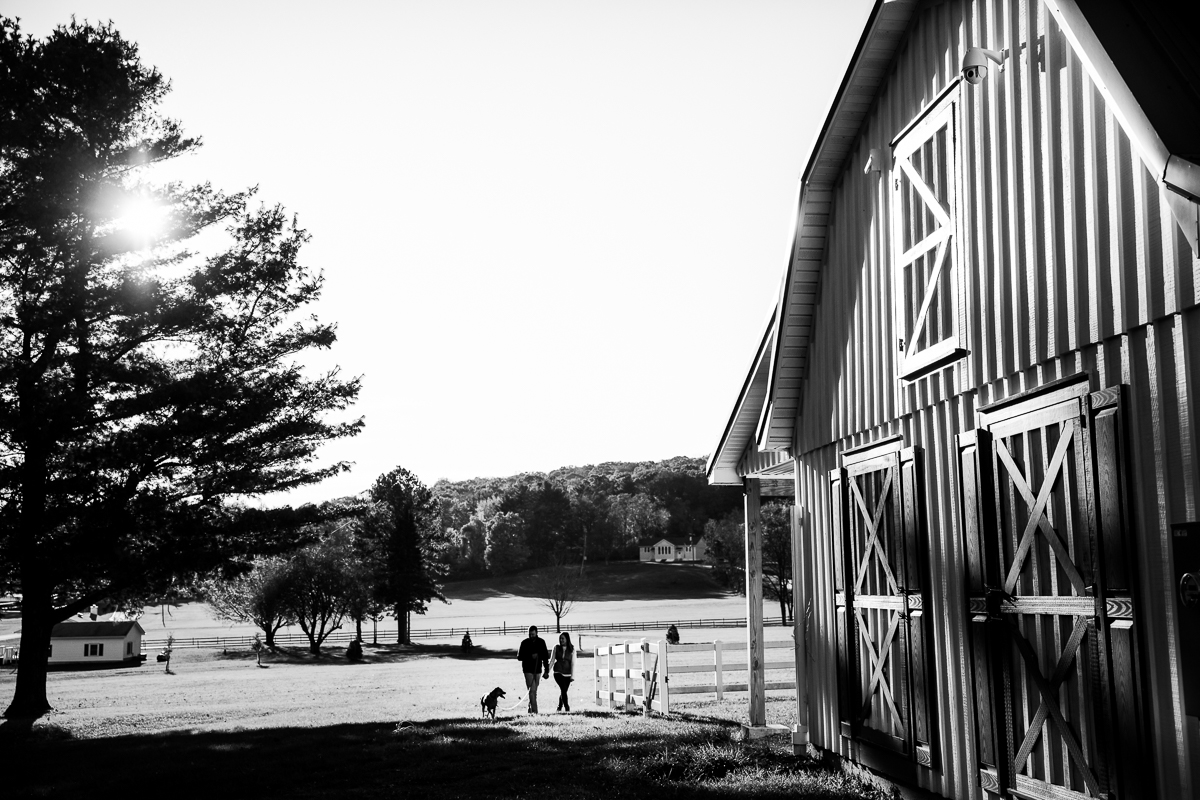 DC couple walking their dog on a farm just outside of washington 