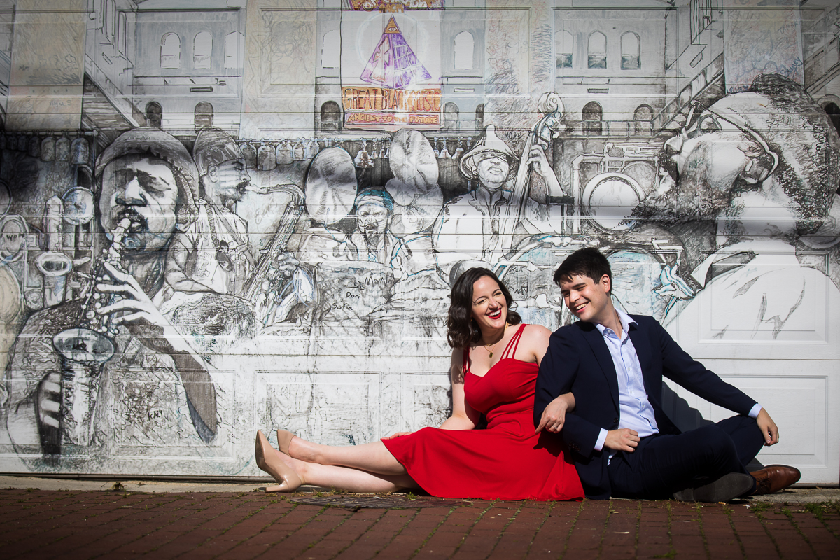 Blagden alley engagement photographer woman with red dress in front of DC musician mural