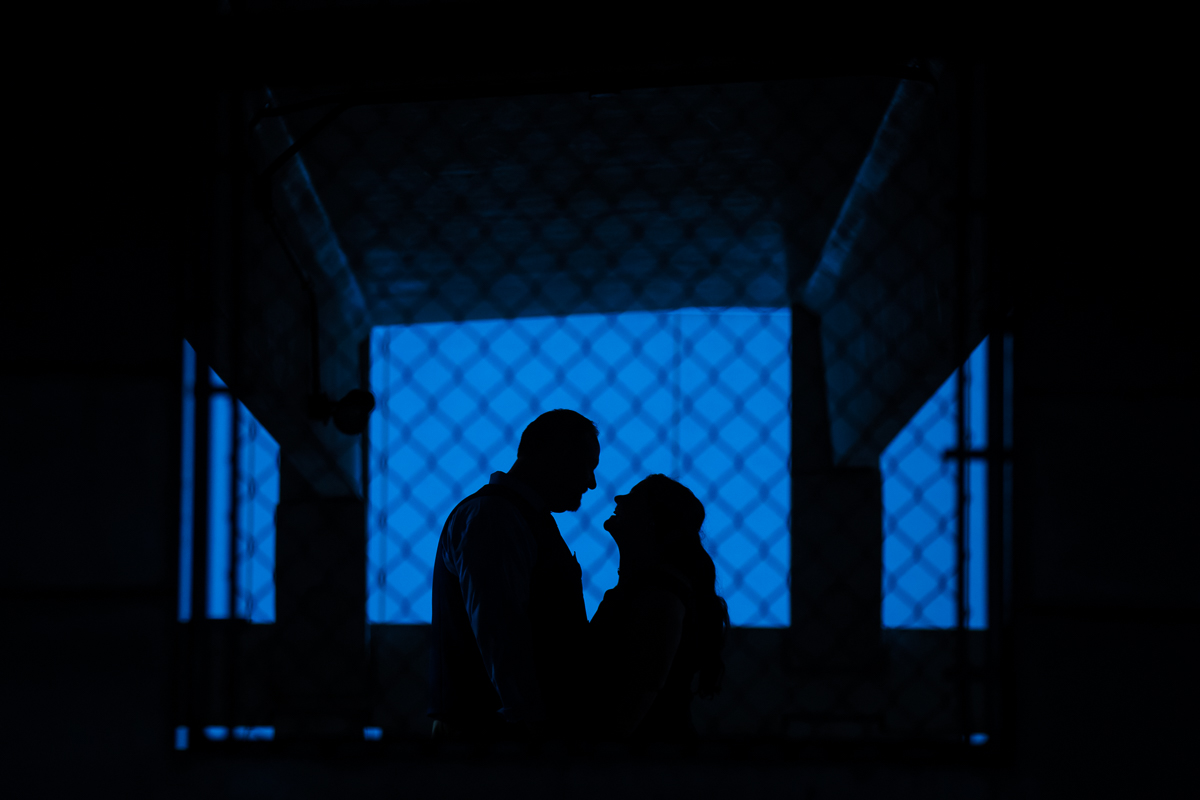 artistic silhouette photo through chainlink fence creative harrisburg engagement