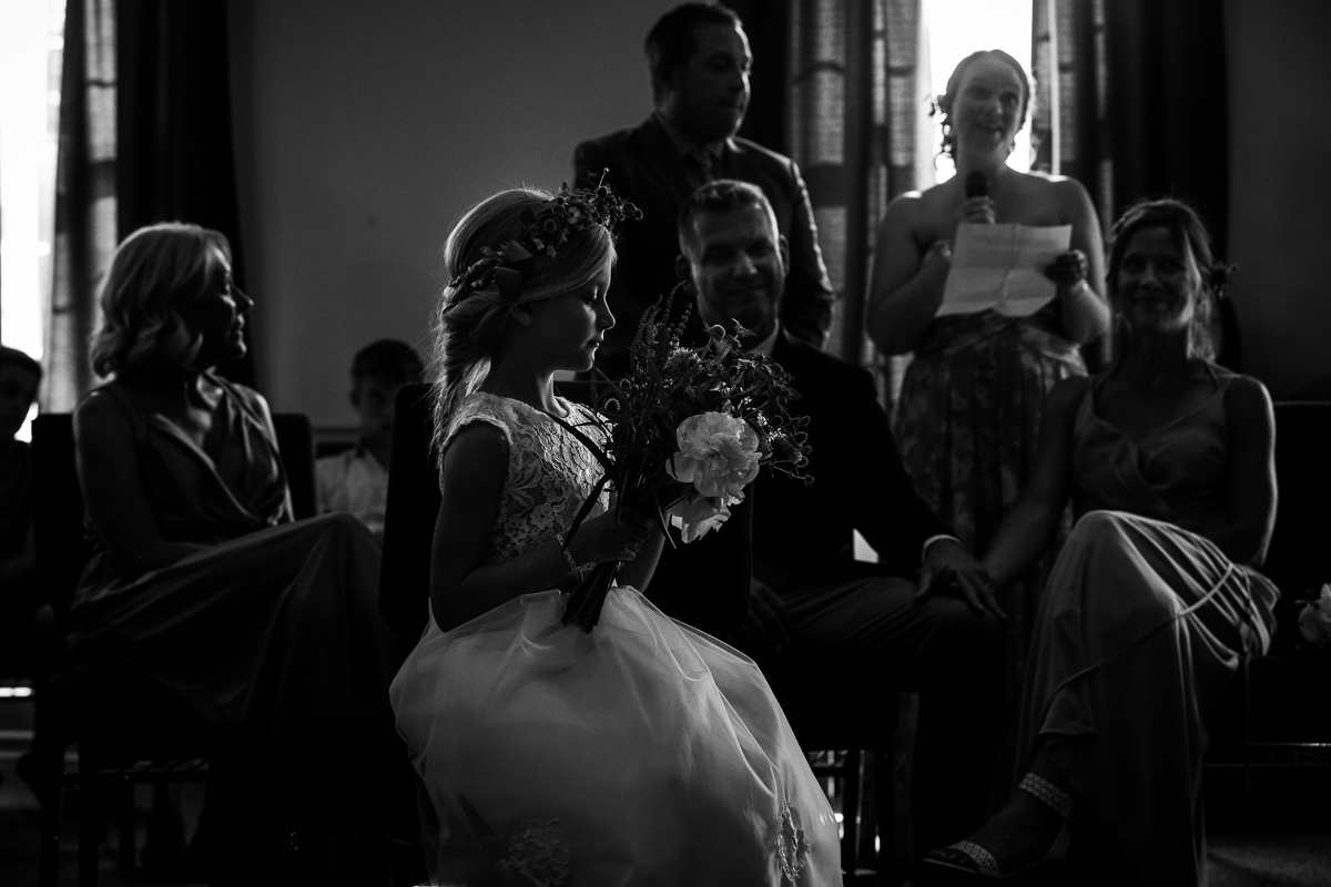 black and white photo of friends and family sharing marriage advice during bell mountain estates wedding ceremony