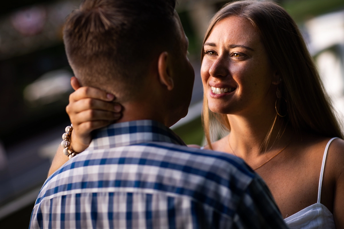 natural candid best central pa wedding engagement photographer girl holding guys neck smiling at him close up
