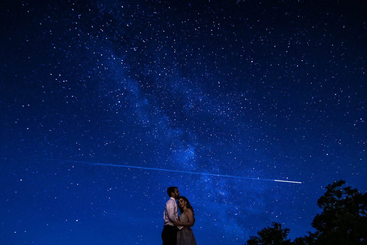 Milky Way after session photographer astral photography DC bride and groom surrounded by night sky with satellite in sky 