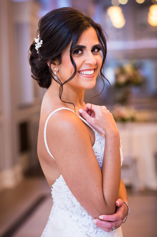 best award winning pa wedding photographer bride smiles while looking at camera 