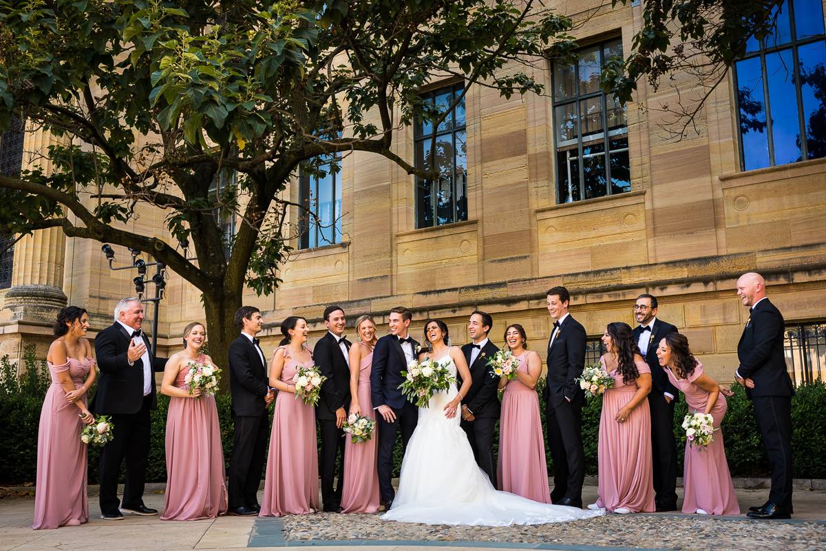 best philadelphia museum of art wedding photographer downtown pa wedding party smiles at each other