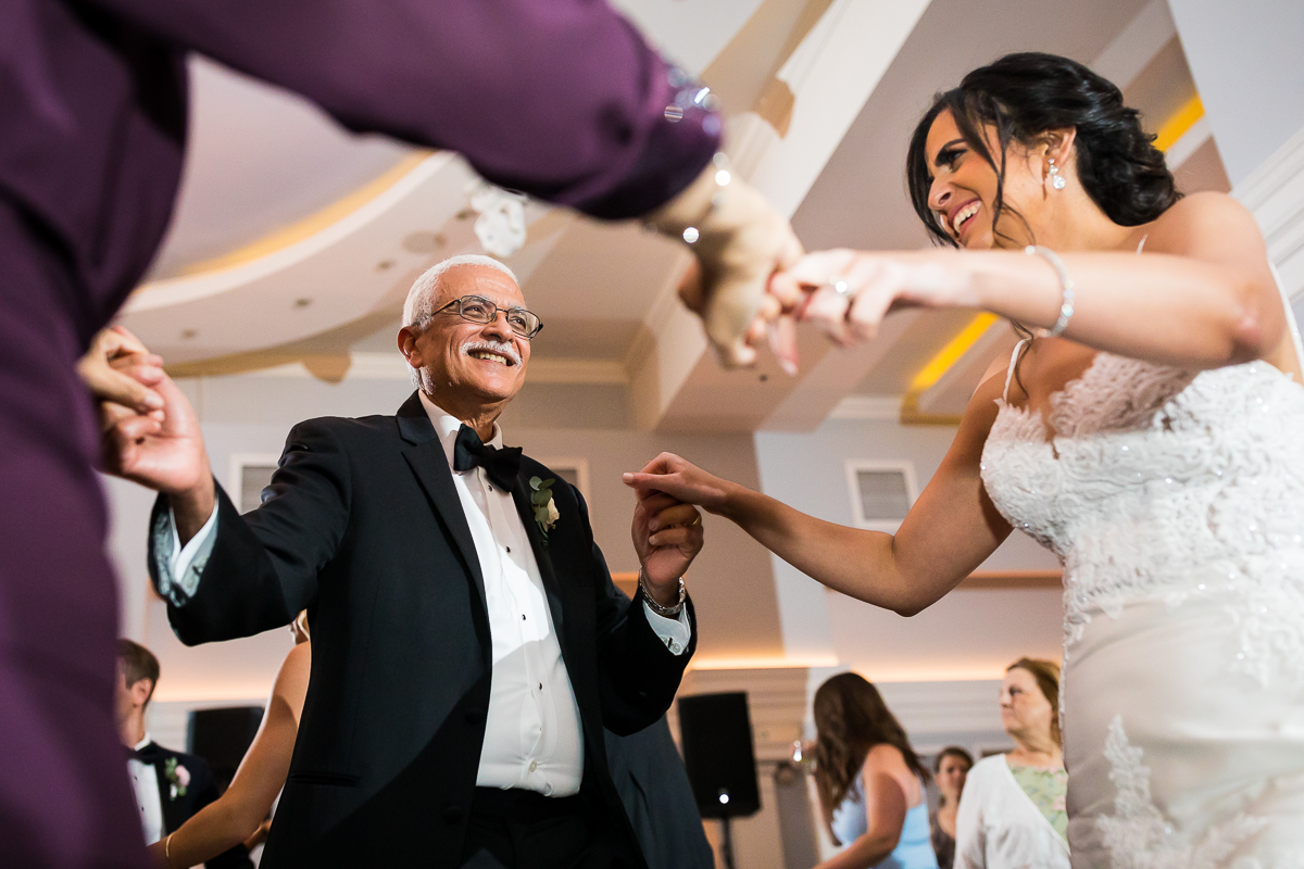bride dancing with parents during wedding reception authentic emotional candid fun wedding photographer pa