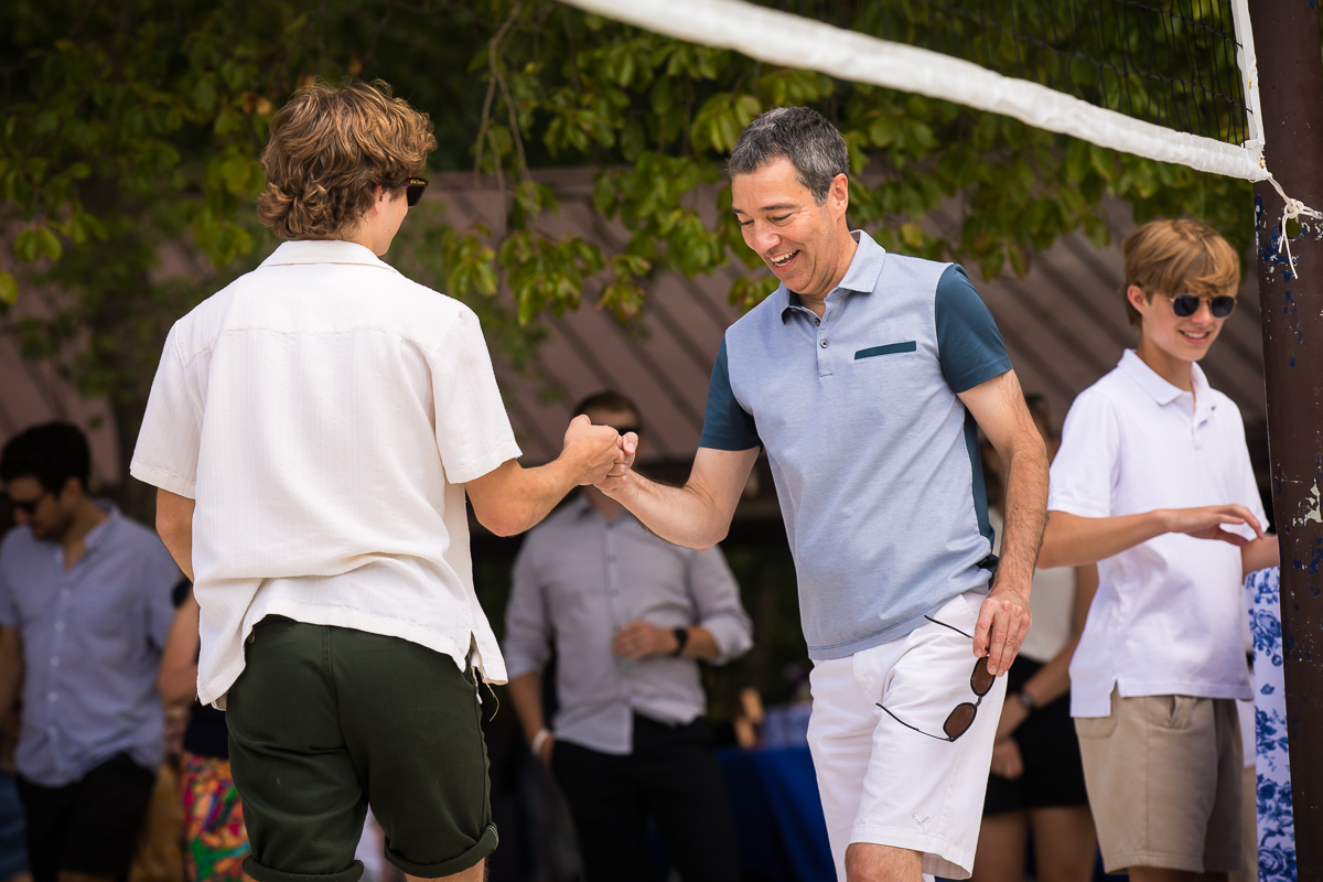 fun dc party photographer two guys fist bump after winning during badminton tournament at bluemont park