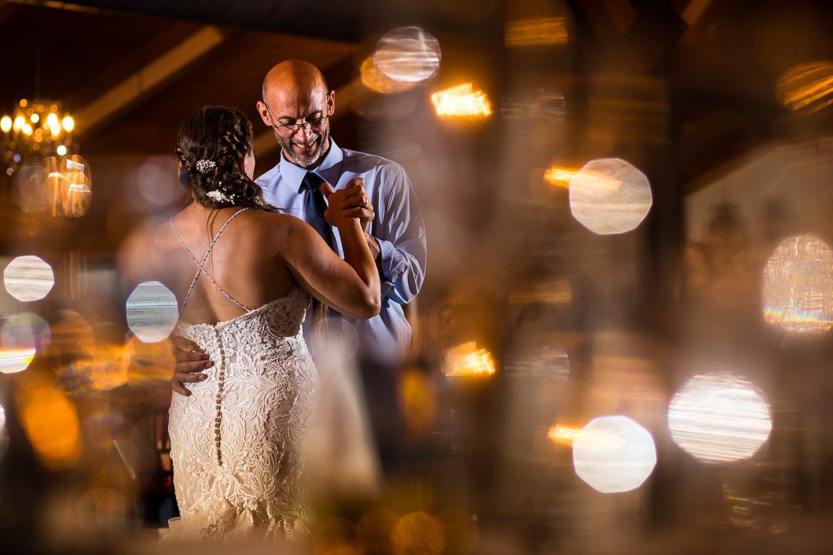 creative artistic unique central pa wedding photographer father daughter dance during wedding reception with bokeh and light streams