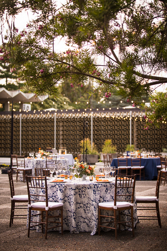 best national arboretum wedding photographer reception table setup outside with string lights and trees