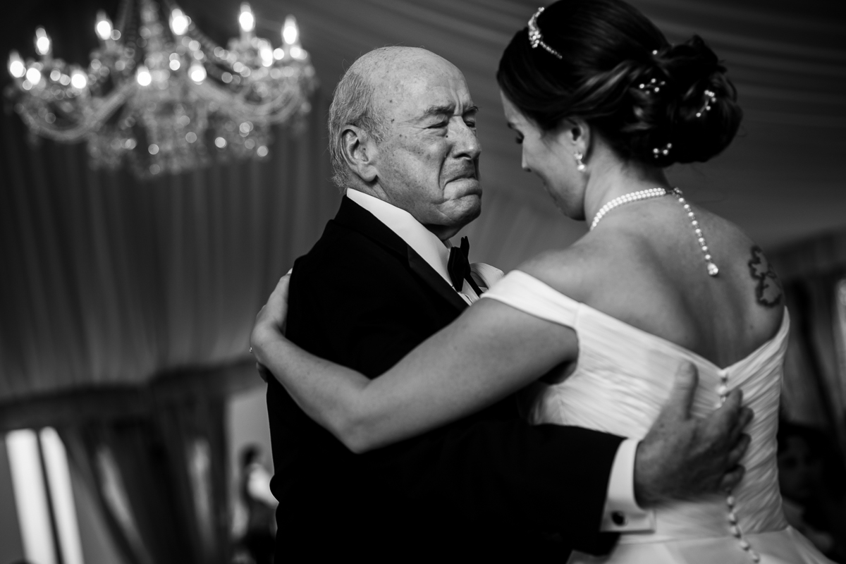 best award winning emotional wedding photographer bride and father during parent dance under tent at river farm reception
