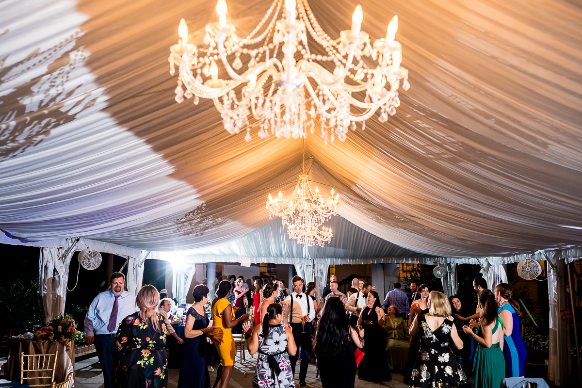 best dc wedding photographer river farm reception tent with chandelier and guest dancing
