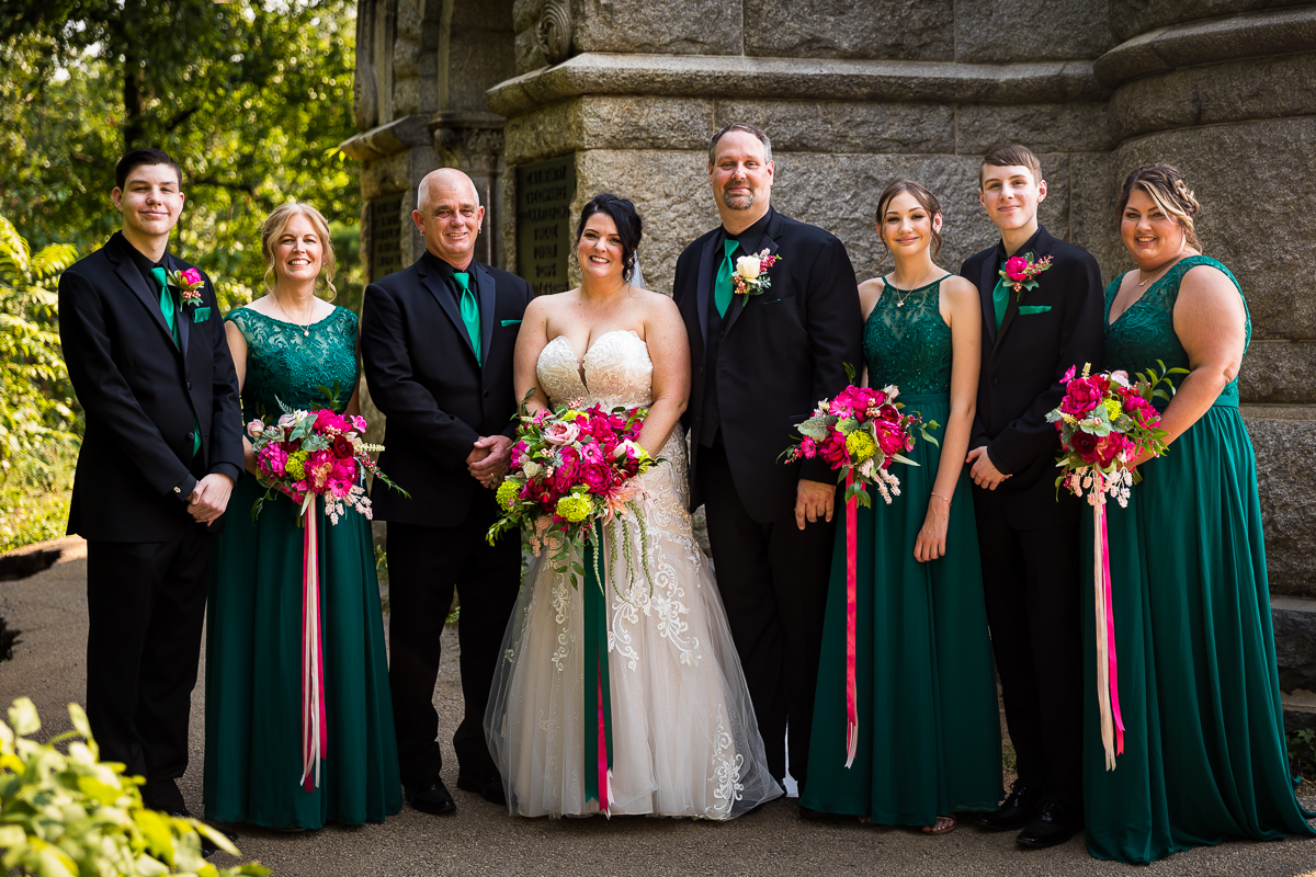 wedding party smiling at camera in emerald with pink and white accents best gettysburg wedding photographer