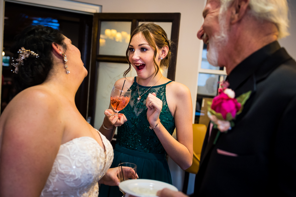 bride smiles and laughs with guests during cocktail hour at gettysburg hotel 