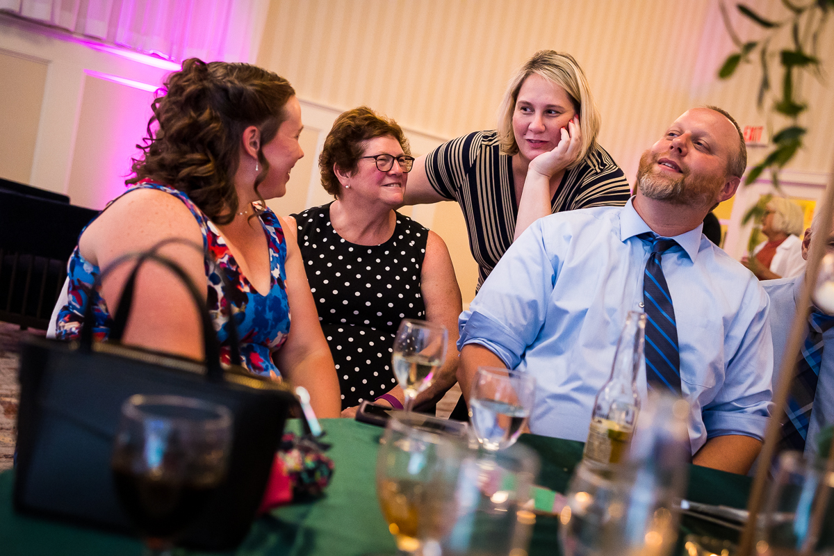 wedding guests talk and laugh at table during gettysburg hotel reception