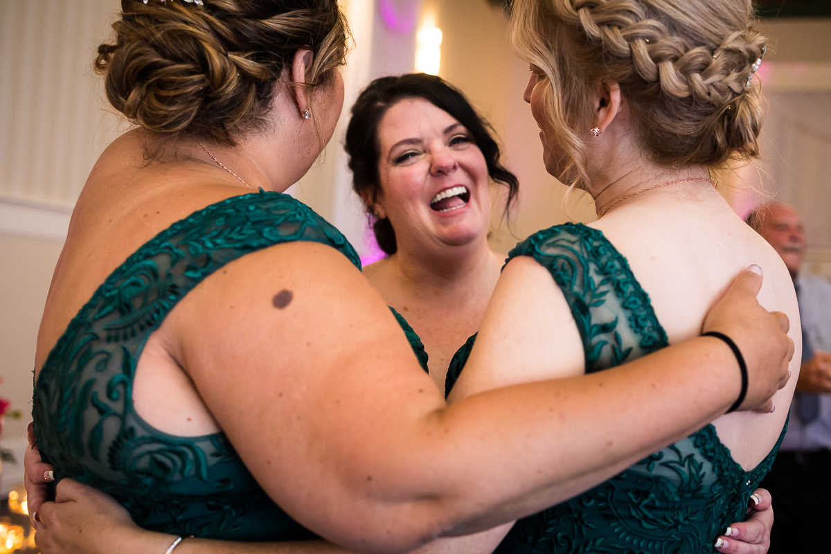 bride dances with matron of honors during gettysburg hotel wedding reception
