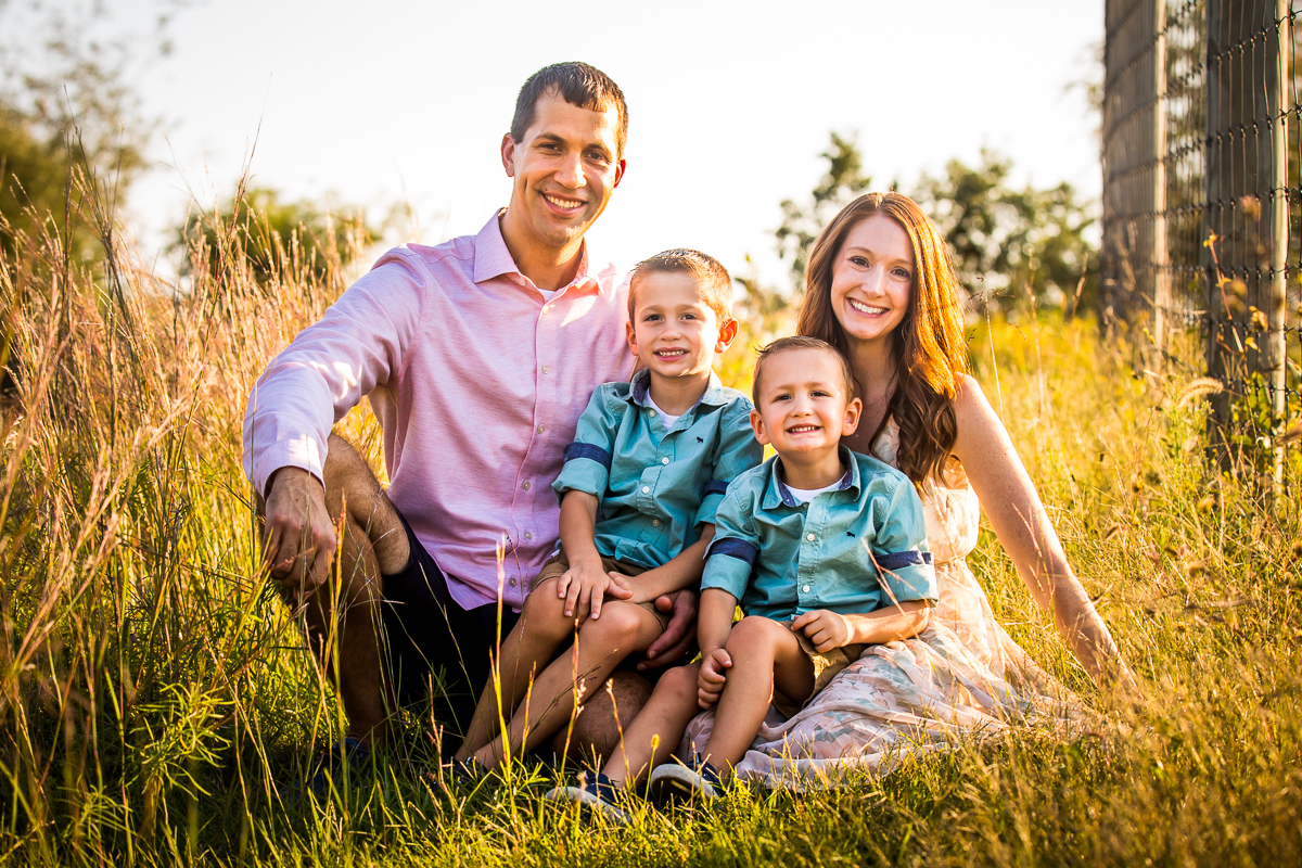 lifestyle family photographer traditional portrait family sitting in grass at Lehigh valley trexler nature preserve