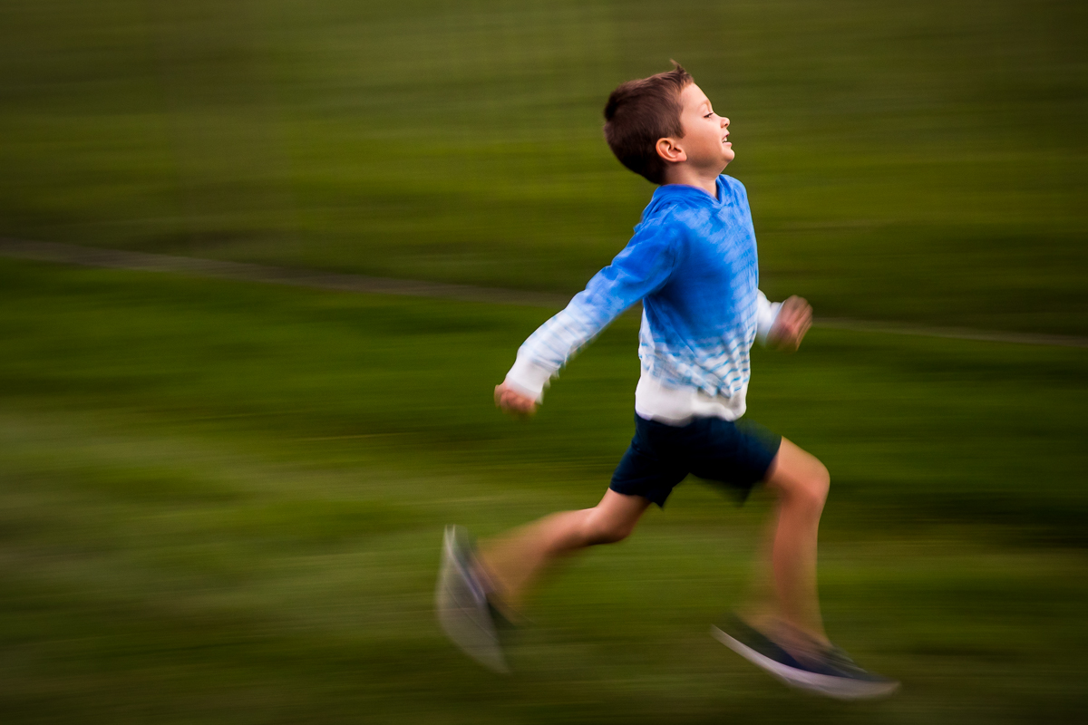 boy running slow shutter speed family fun photographer