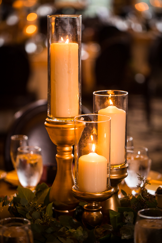 Stroudsmoor Terraview wedding reception table decor romantic pillar candles with gold bases with greenery