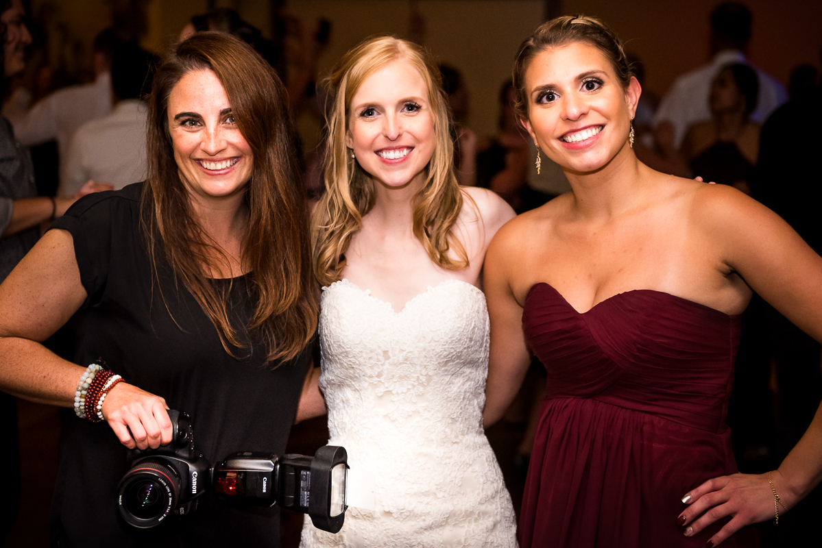 photographer with bride and bridesmaid previously photographed at stroudsmoor wedding reception