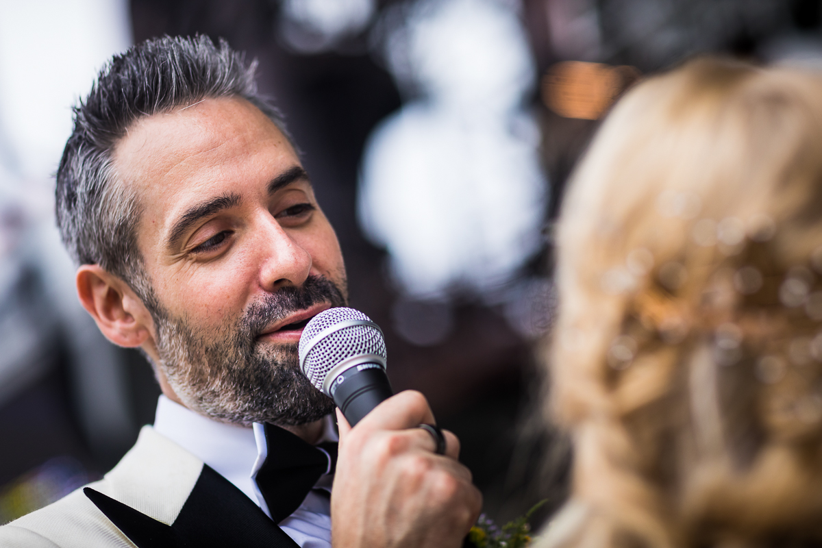 authentic candid wedding after-session photographer groom sings to bride shallow 