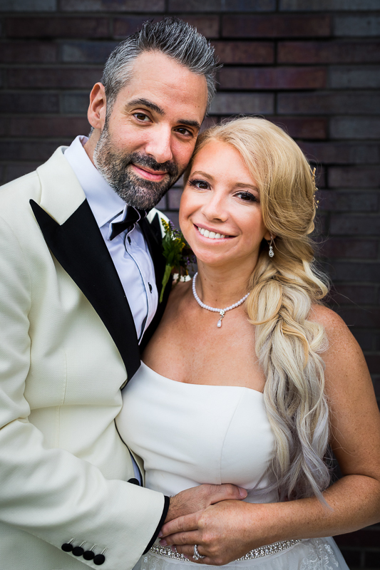 bethlehem pa wedding engagement photographer bride and groom holding each other smiling at camera