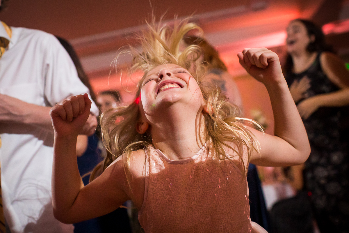 young girl in pink dress dancing at Omni Bedford Springs wedding reception