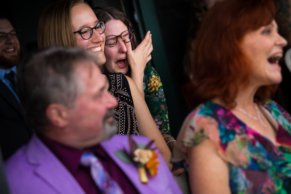 emotional authentic candid lake raystown wedding photographer guests wiping tears away during ceremony