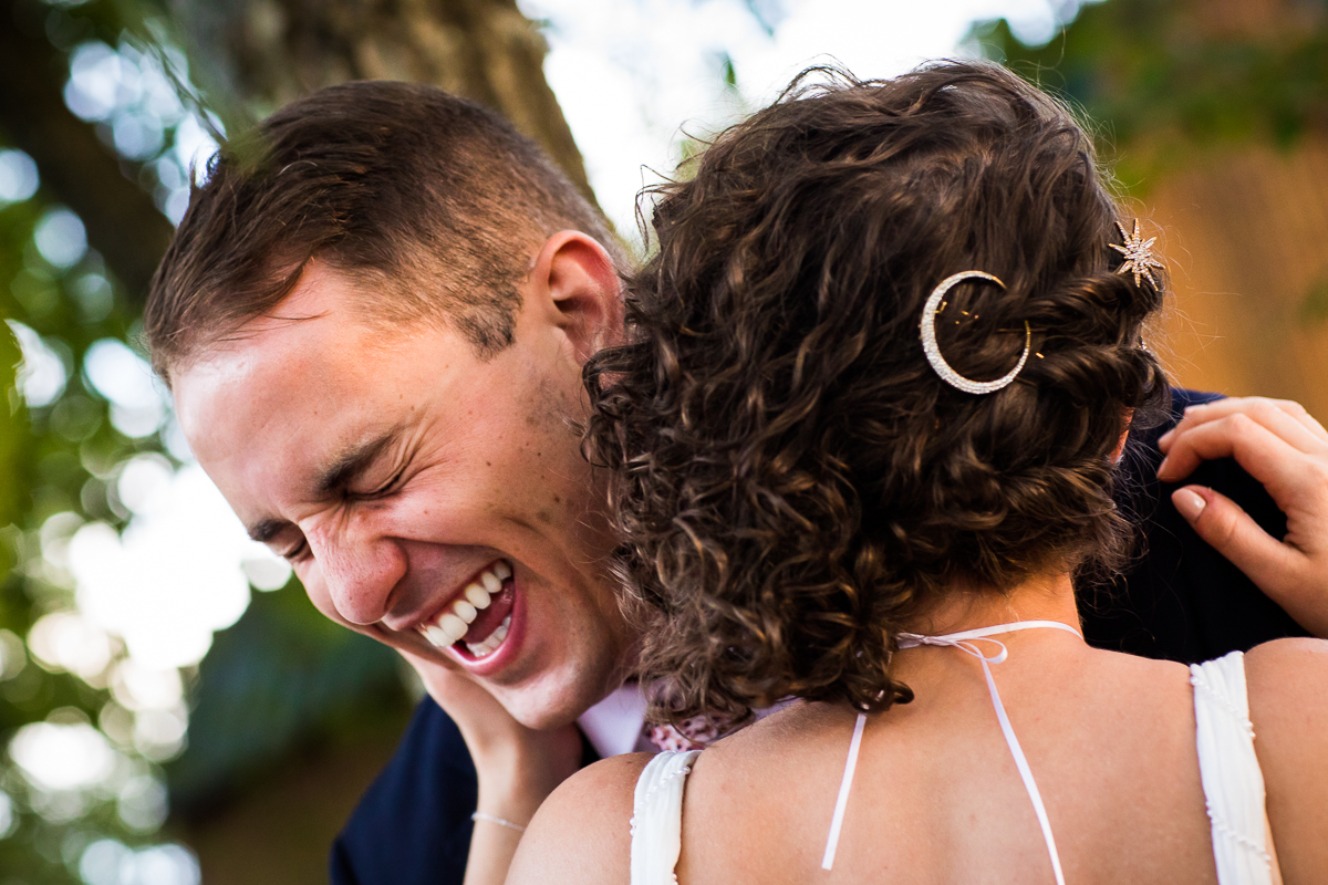 emotional candid authentic lake raystown wedding photographer bride and groom smiling and laughing