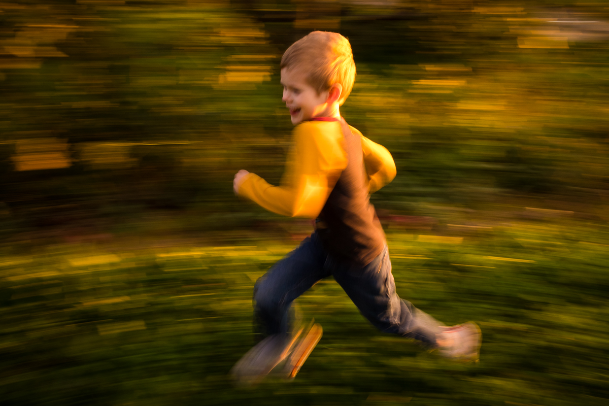 boy running through woods slow motion blur creative artistic central pa photographer