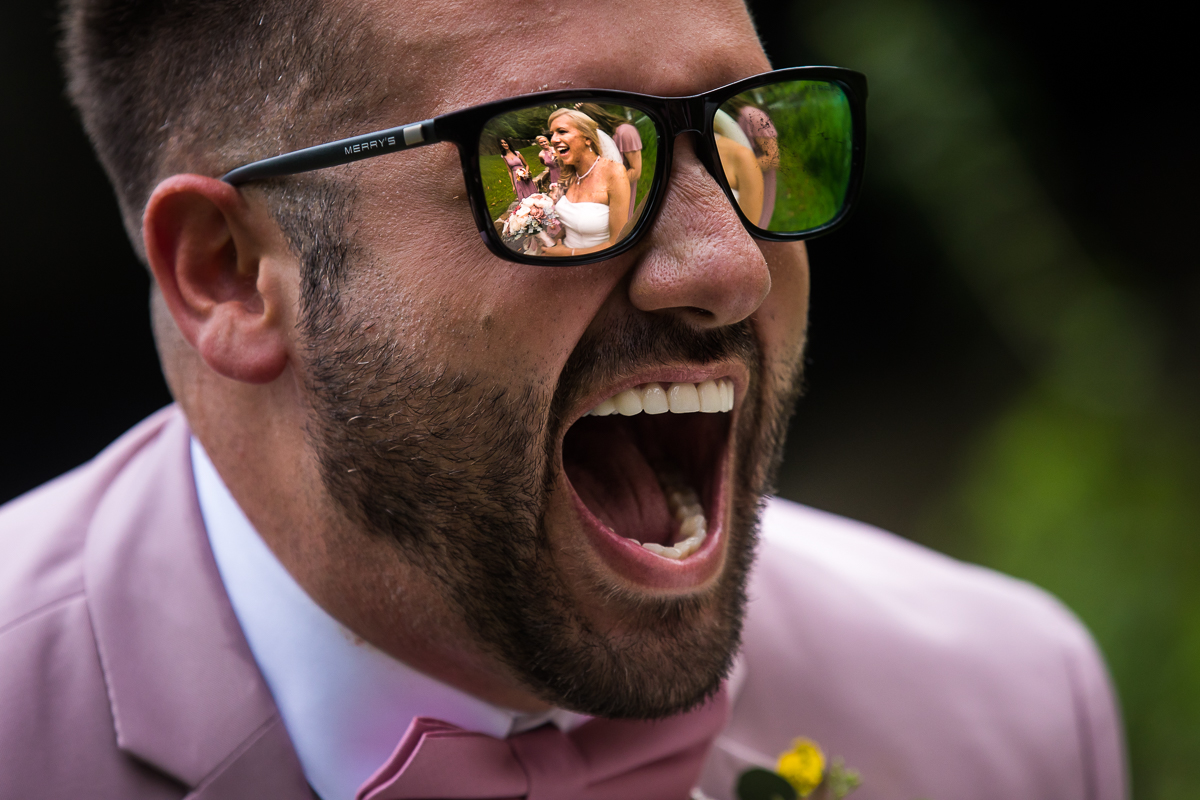 brides men with crazy reaction when seeing bride reflecting in sunglasses artistic creative wedding photographer central pa