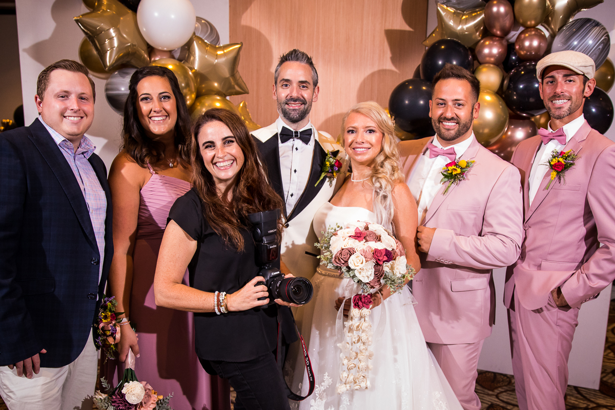 best central pa Lehigh Valley wedding photographer standing with past couples and current couples