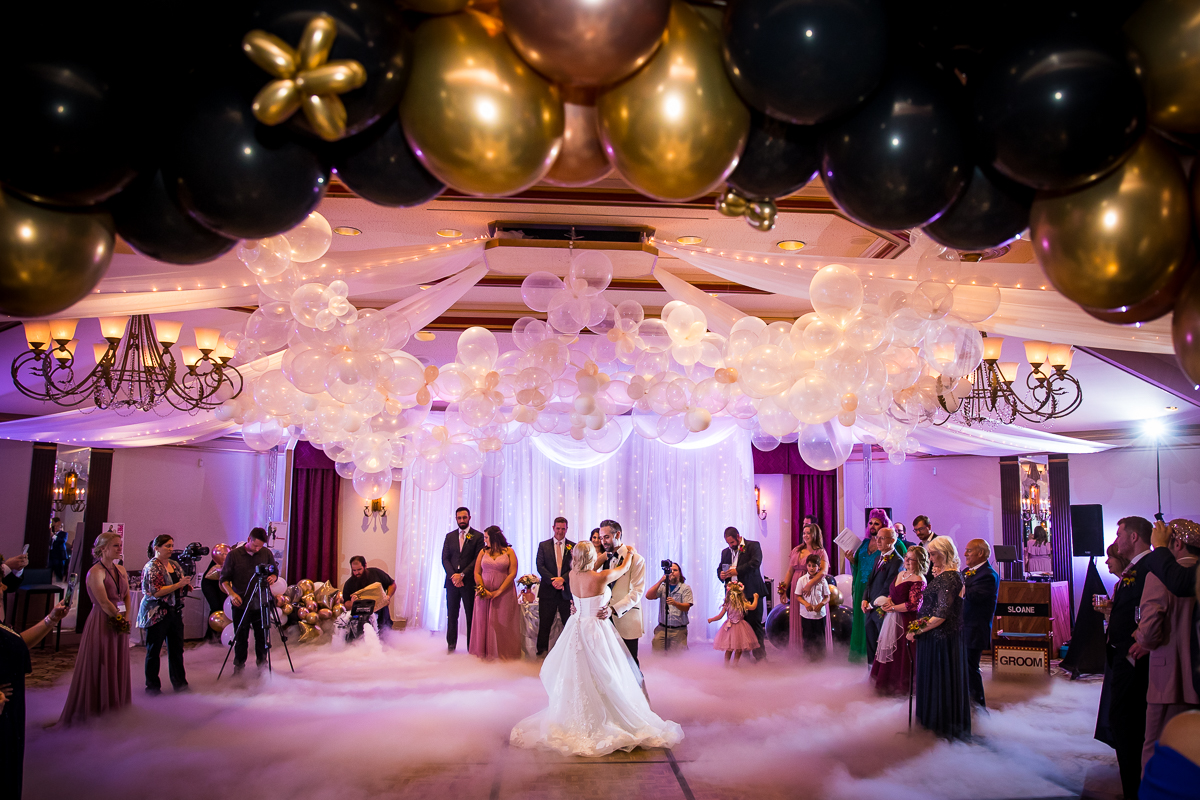 best Lehigh Valley wedding photographer bride and groom first dance with smoke surrounding them and balloons
