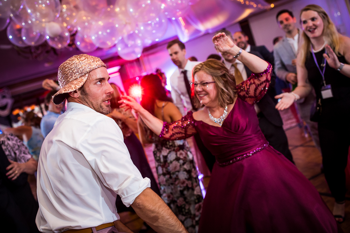 brides mom dancing with wedding guest 