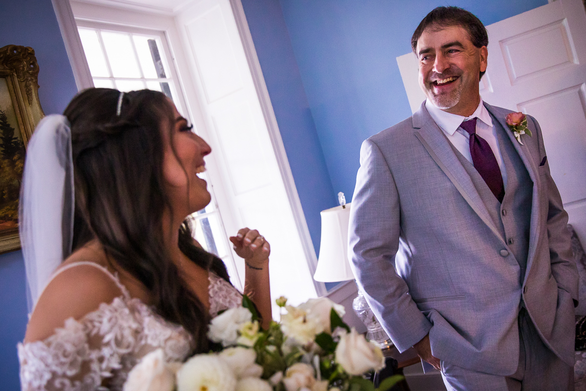 bride's dad and bride smiling at each other during first look emotional authentic Candid central pa wedding photographer