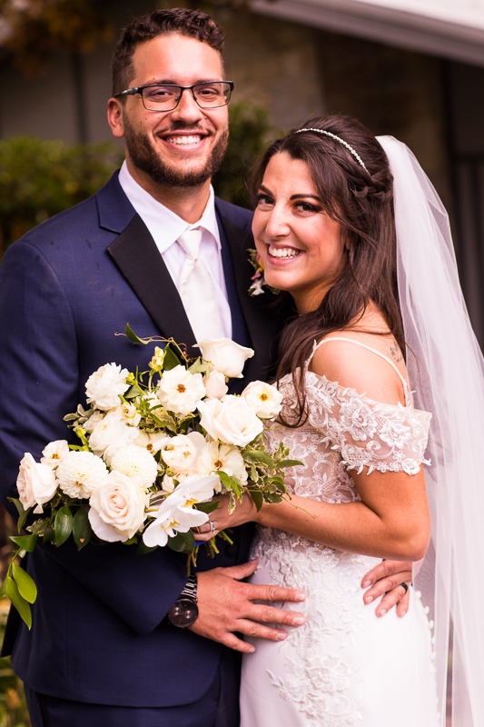 traditional wedding portrait bride and groom smiling at camera boiling springs pa allenberry resort