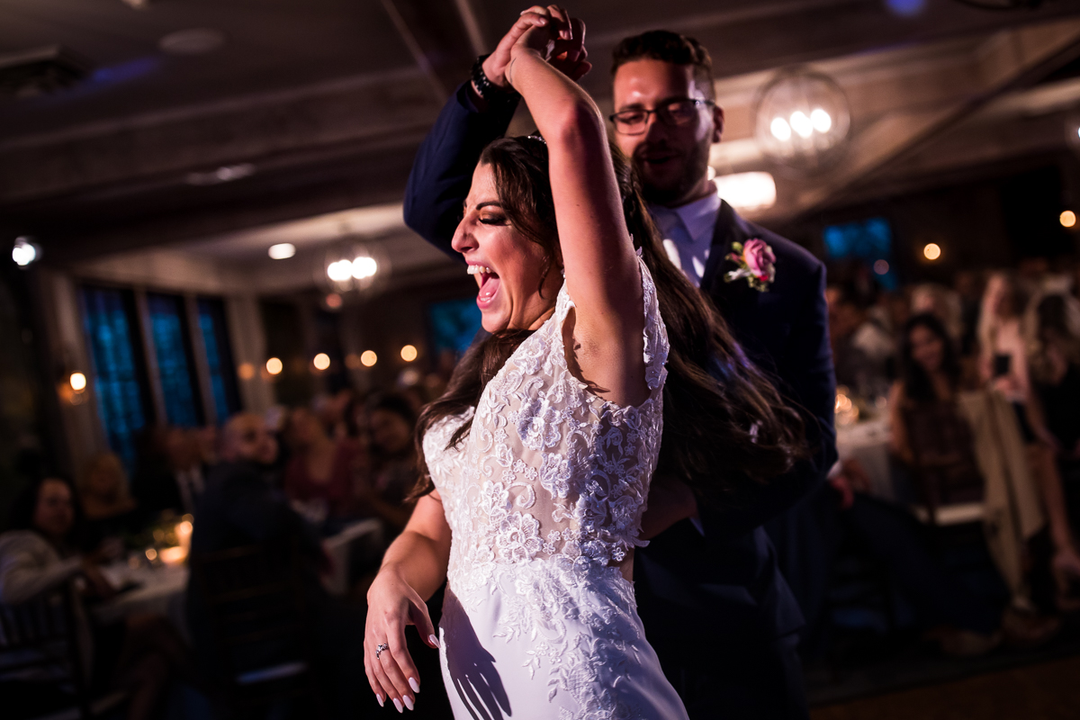 groom spinning bride during first dance bride laughs and smiles allenberry resort wedding reception