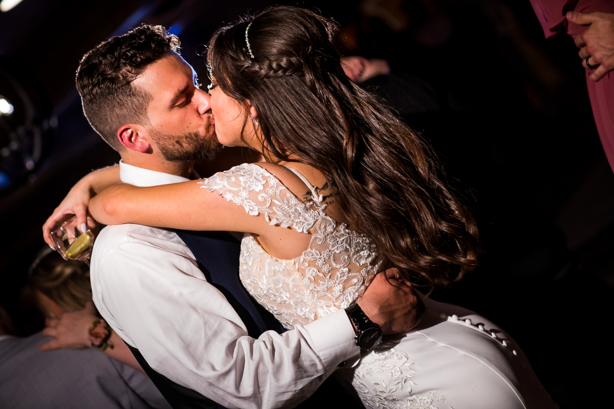 bride and groom kissing while dancing during allenberry resort wedding reception