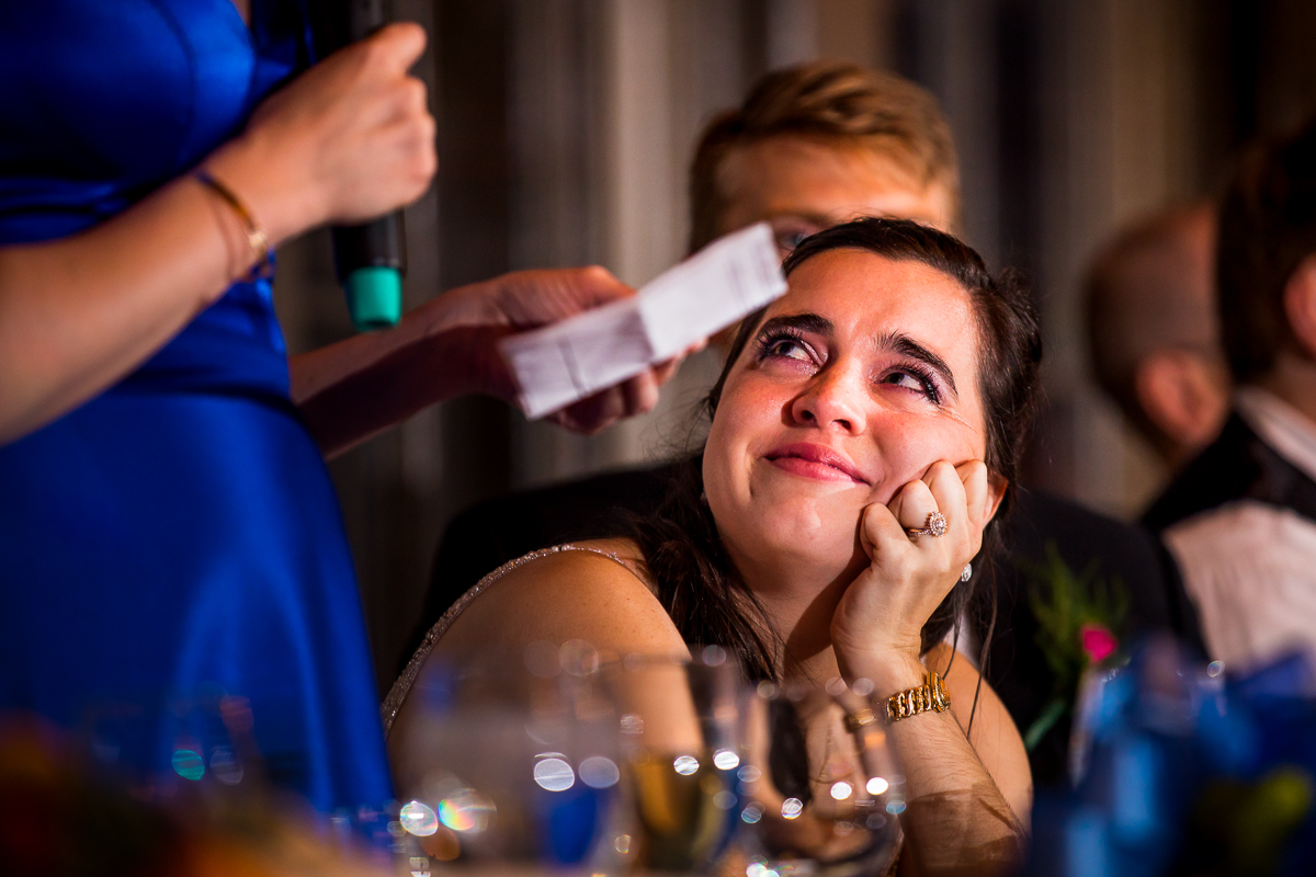 emotional candid authentic central pa wedding photographer bride crying looking at MOH during toast