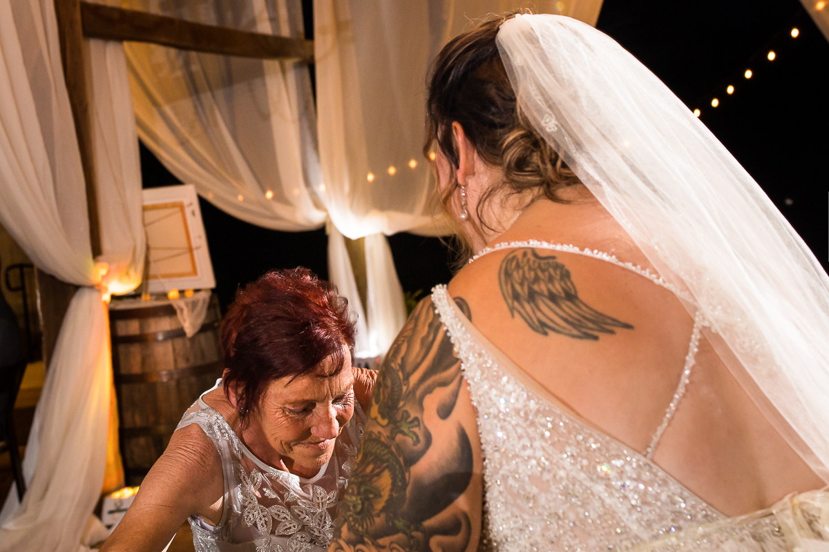 bride with angel wing tattoo dancing with late mother 