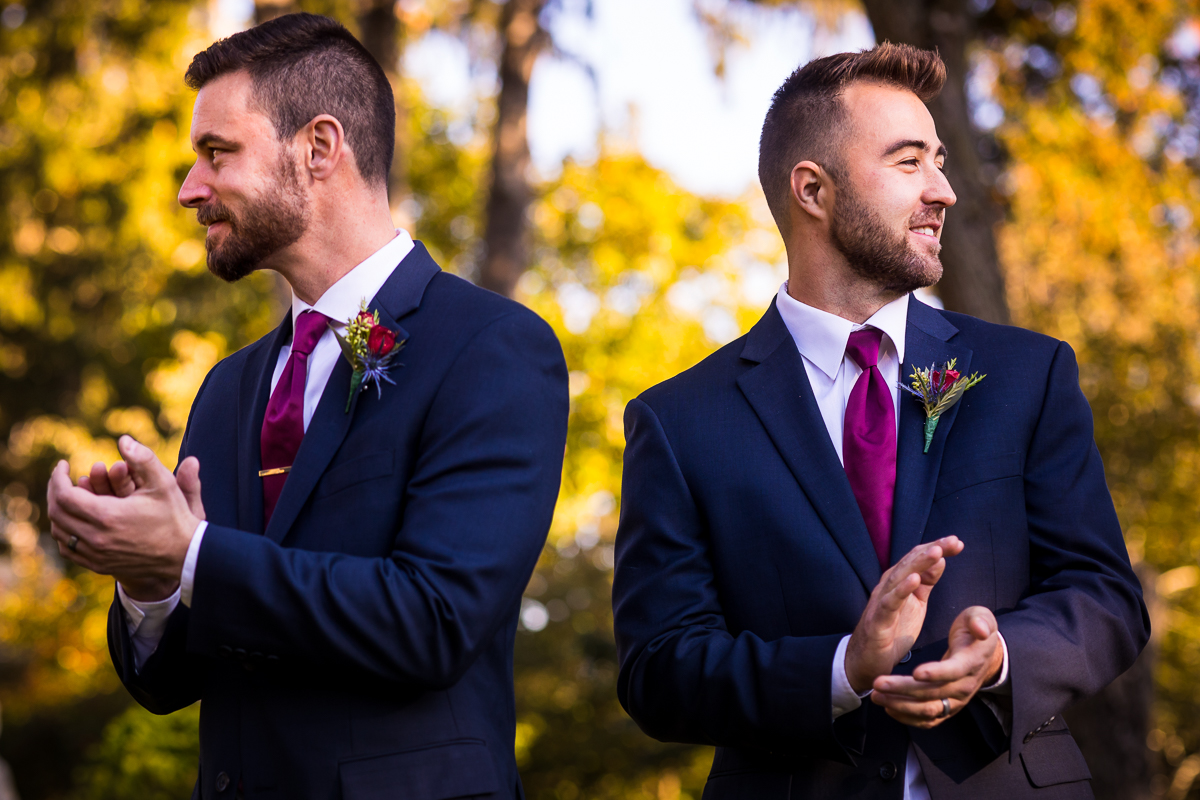  groomsmen clapping at conclusion of wedding ceremony