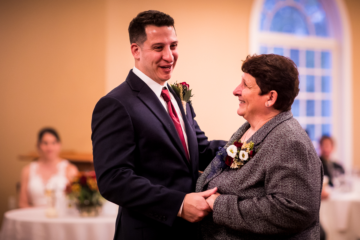 groom dancing with mom during parent dance tradition