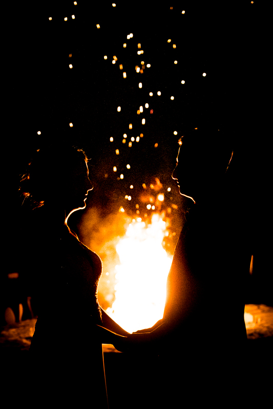 creative artistic unique wedding photographer bride and groom silhouetted in front of fire pit at Linwood estate wedding reception