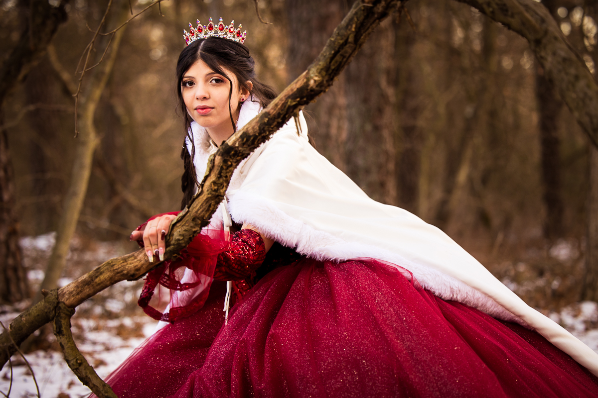 creative artistic senior portrait photographer girl wearing red dress and white cape with red jeweled crown red riding hood