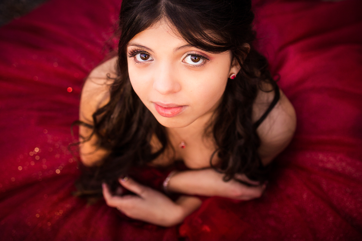 best central PA quinceanera photographer close up of girl wearing red dress with necklace