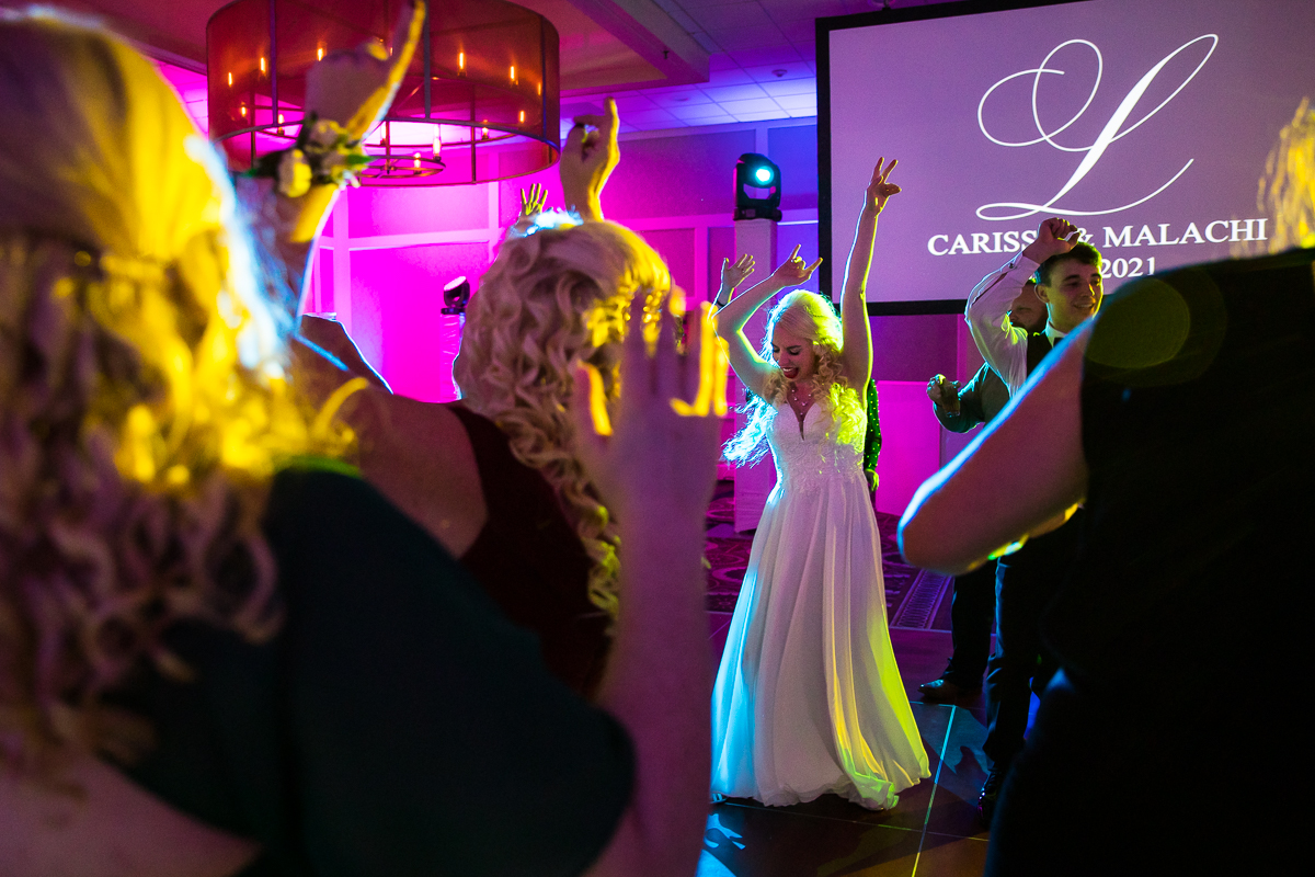 Colorful and vibrant photo of the bride dancing during her best western Harrisburg wedding reception