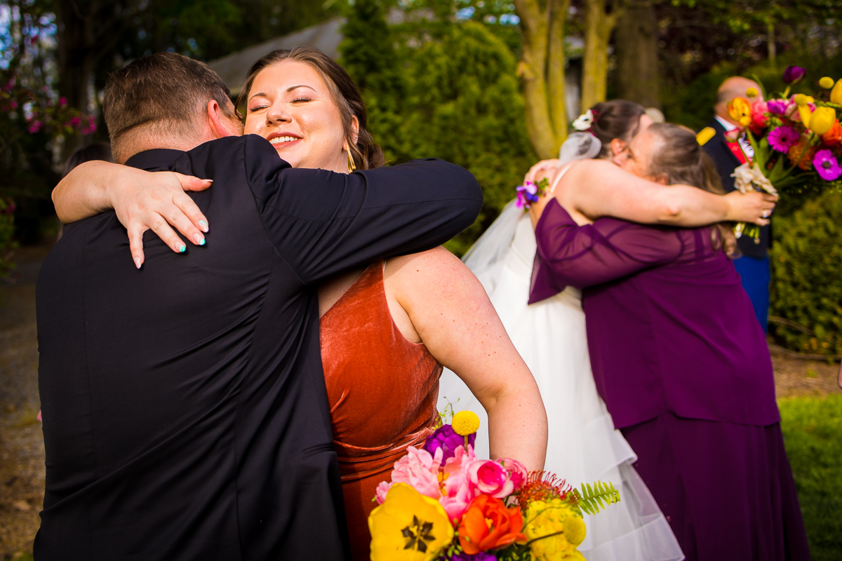 image of the bride and groom hugging family and friends after their wedding ceremony in carlisle pa 