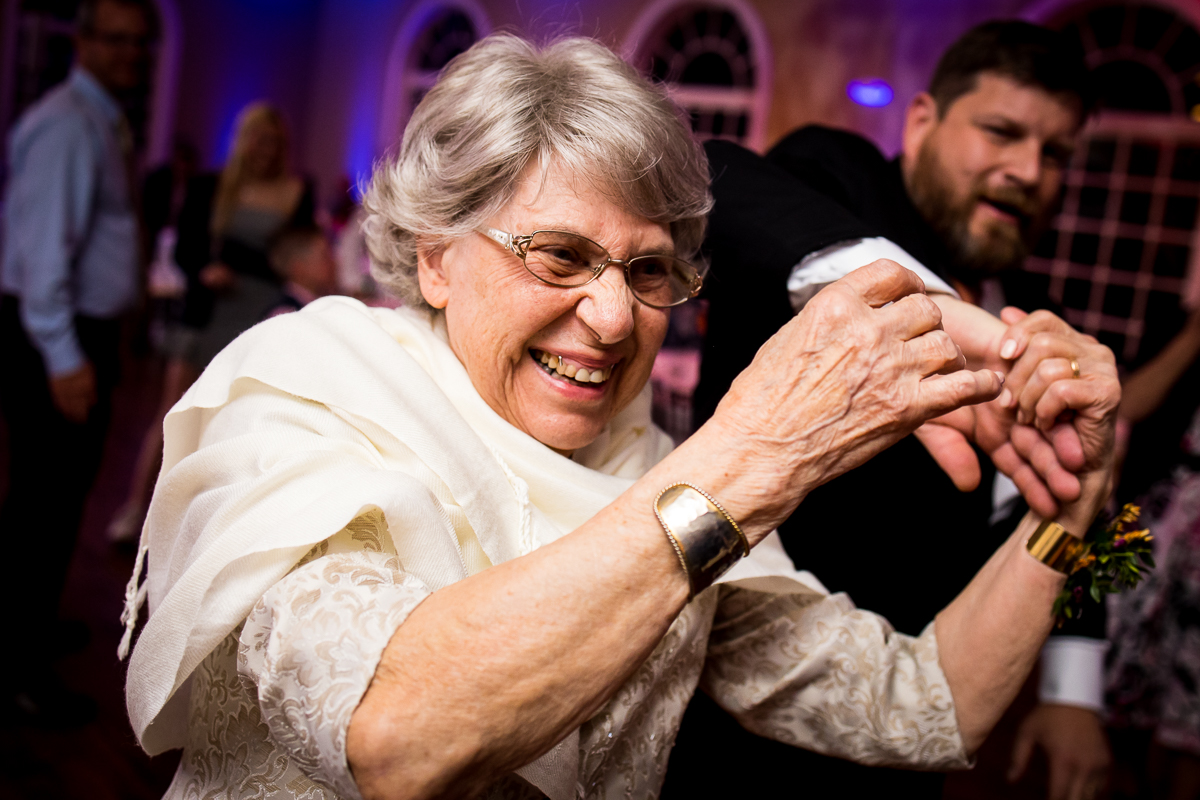 image of their grandma dancing during this linwood estate wedding reception